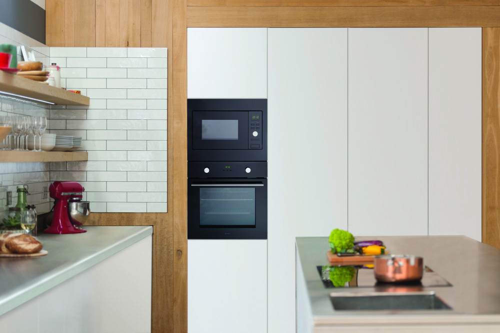 Sleek styling with Caple’s versatile,  new CM123BK microwave and grill