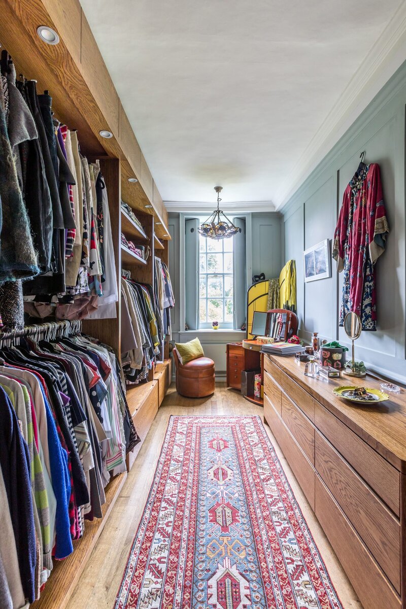 Located off the master suite, this beautiful, bespoke dressing room  was designed and made in the UK by Mark Taylor Design